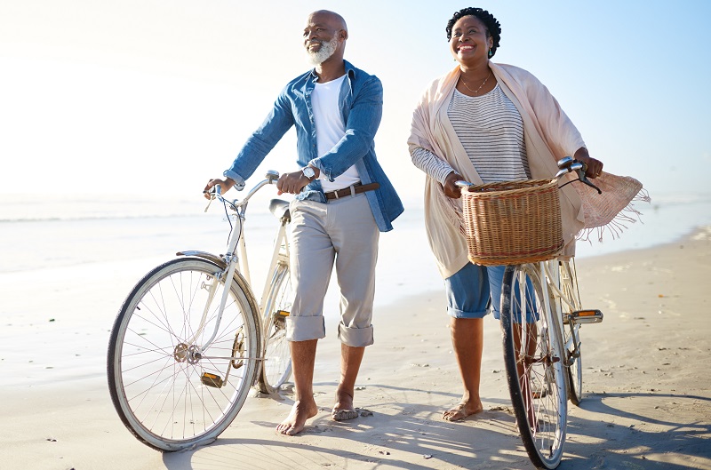 Couples walking in a beach